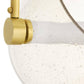 Close-up of a gold shower head with water droplets on a white background
