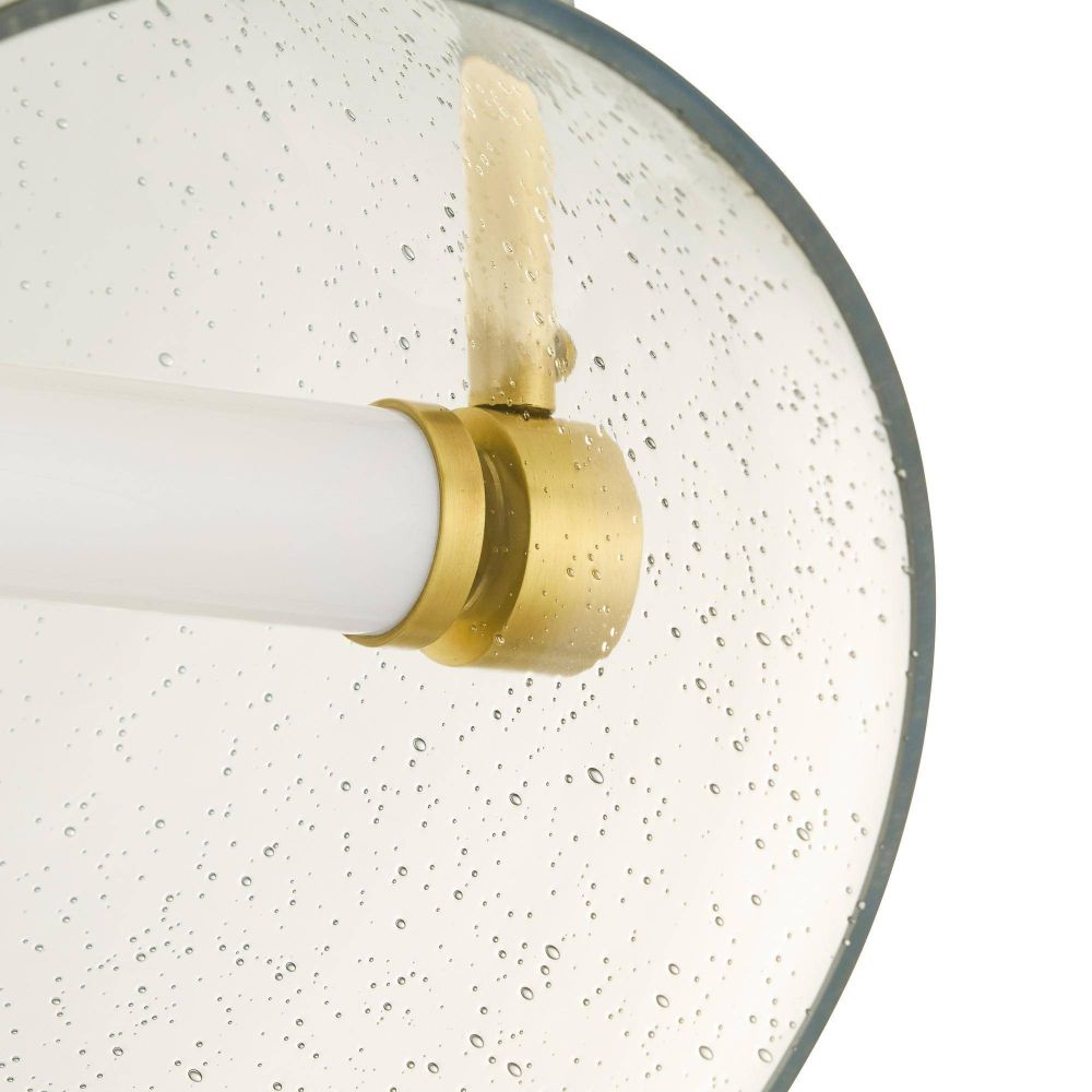 Close-up of a light fixture with a gold and white design on a white background