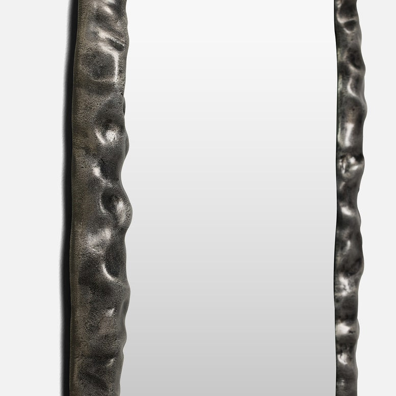 Two metallic objects with textured surfaces on a white background
