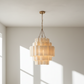 Chandelier hanging in a room with natural light