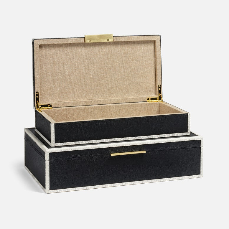 Black jewelry box with beige interior on a white background