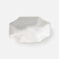Hexagonal marble dish on a white background