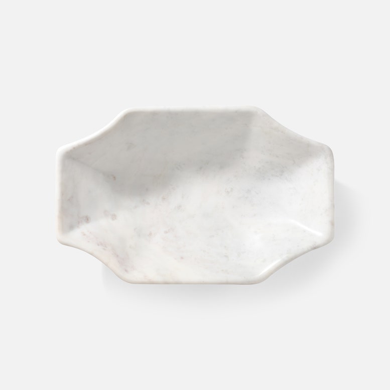 Hexagonal marble dish on a white background