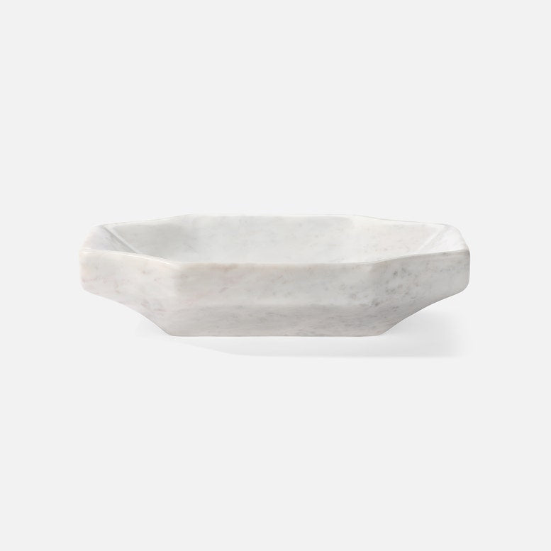 Hexagonal marble dish on a white background