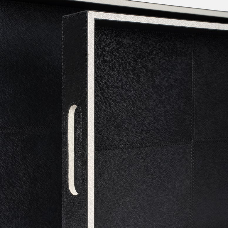 Black leather armchair with a white frame and handle