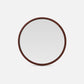 Round mirror with a leather frame on a white background