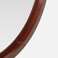 Close-up of a brown leather belt on a light gray background
