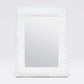 Mirror with a decorative white bead frame on a light gray background