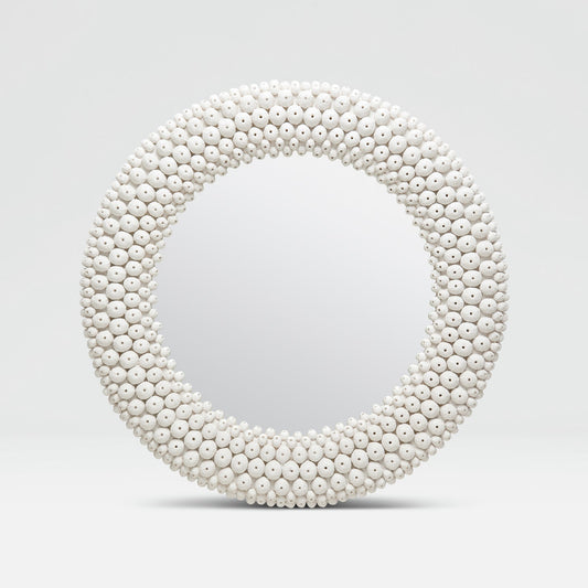 Round mirror with a white bead frame on a light gray background