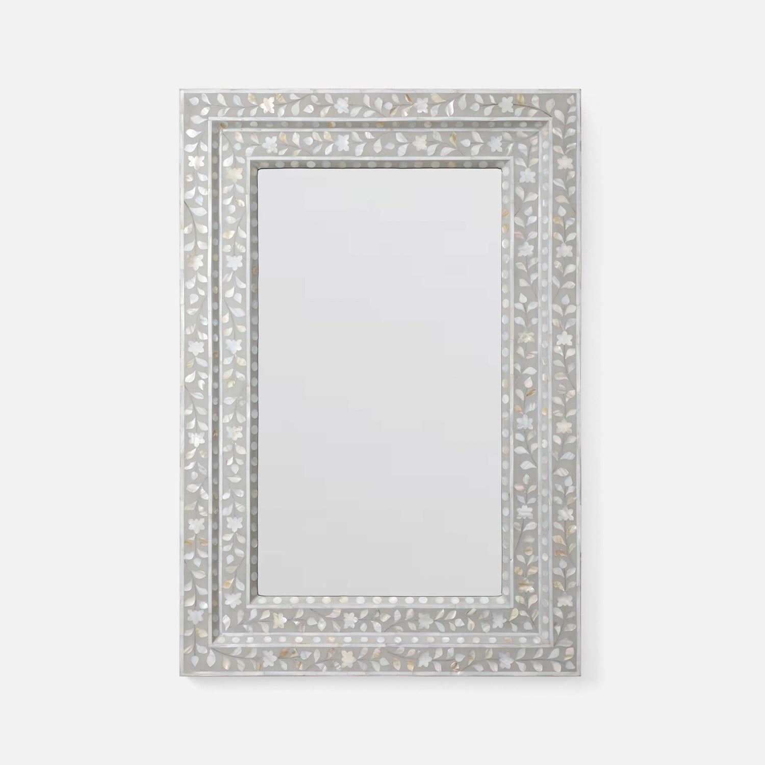 A rectangular wall mirror with an ornate silver-toned frame made of inlay mosaic pieces, shown against a plain light gray background.