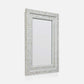 A rectangular wall mirror with an ornate silver frame made of inlay mosaic pieces, shown against a plain light gray background.