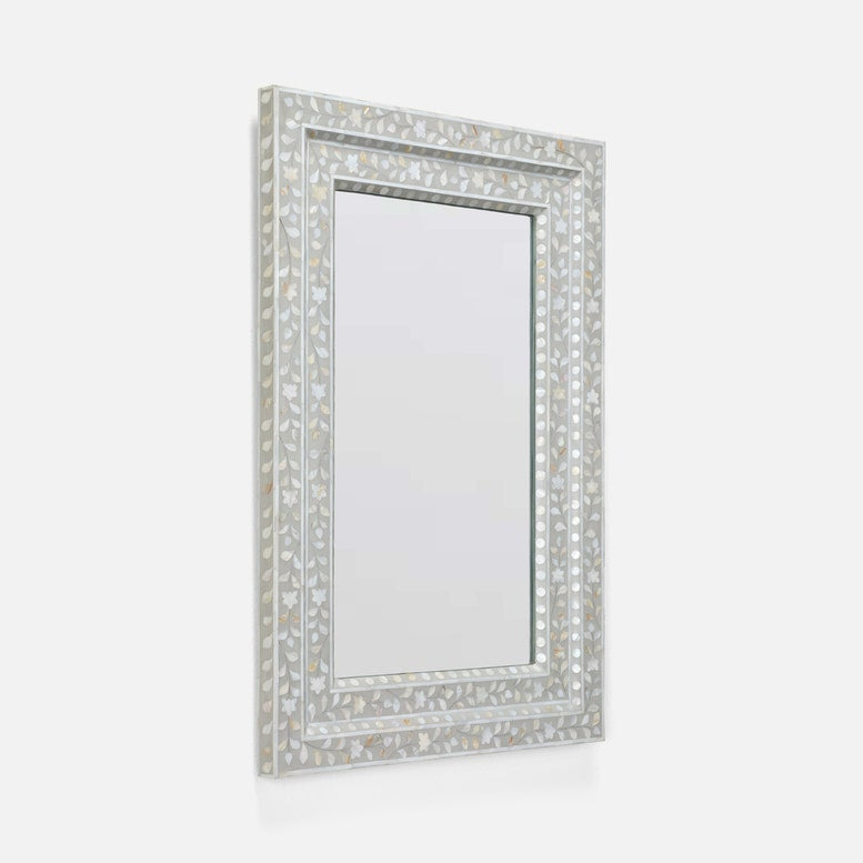 A rectangular wall mirror with an ornate silver frame made of inlay mosaic pieces, shown against a plain light gray background.
