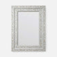 A rectangular wall mirror with an ornate silver frame made of inlay mosaic shell-like pieces in a leaf pattern, shown against a plain light gray background.