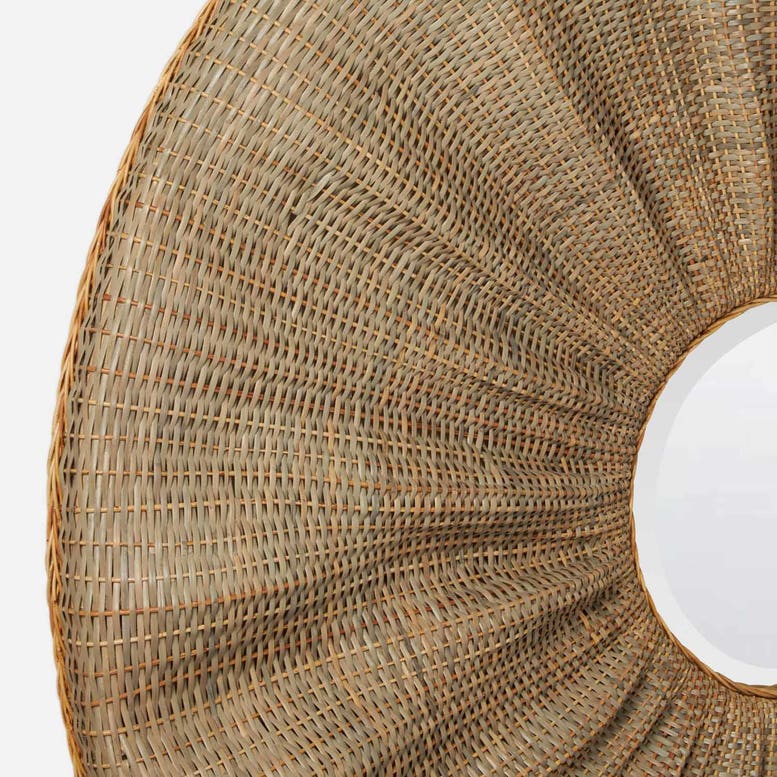 Close-up of a woven circular product, likely a wicker or rattan planter, basket, or decorative ring, showing the detailed natural brown and tan texture against a white background.