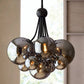 Modern chandelier with smoked glass globes in a room setting