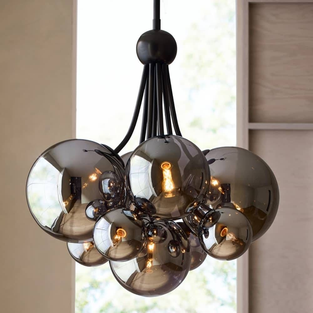 Modern chandelier with smoked glass globes in a room setting