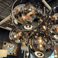 Chandelier with reflective glass spheres in a store setting