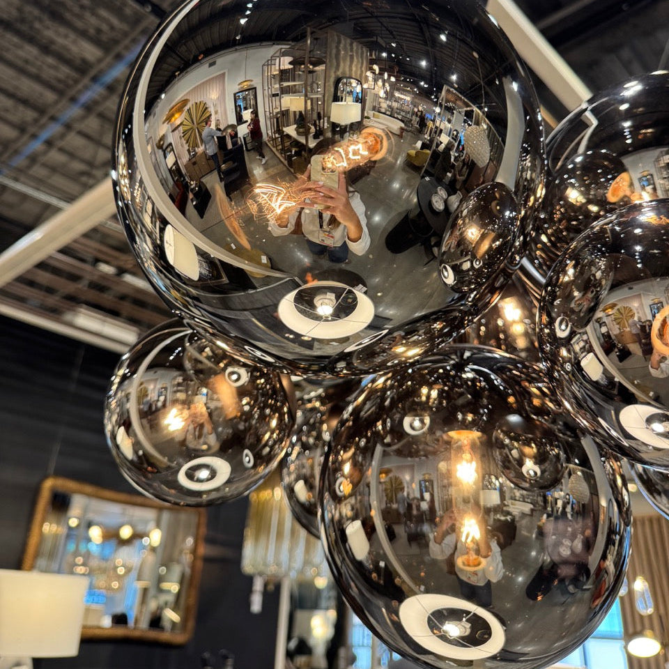 Chandelier with reflective glass spheres in a store setting