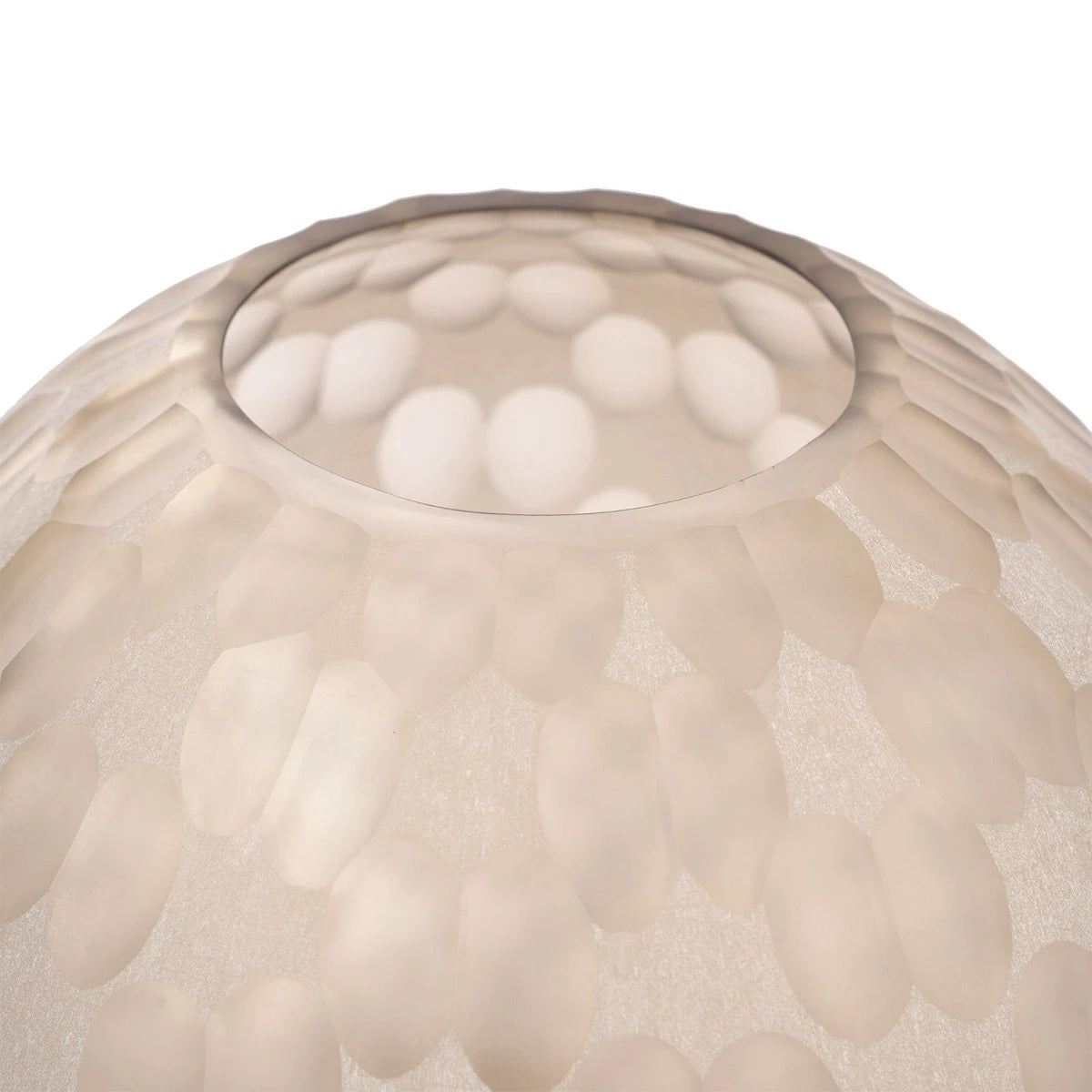 Close-up of a textured beige glass lvase on a white background