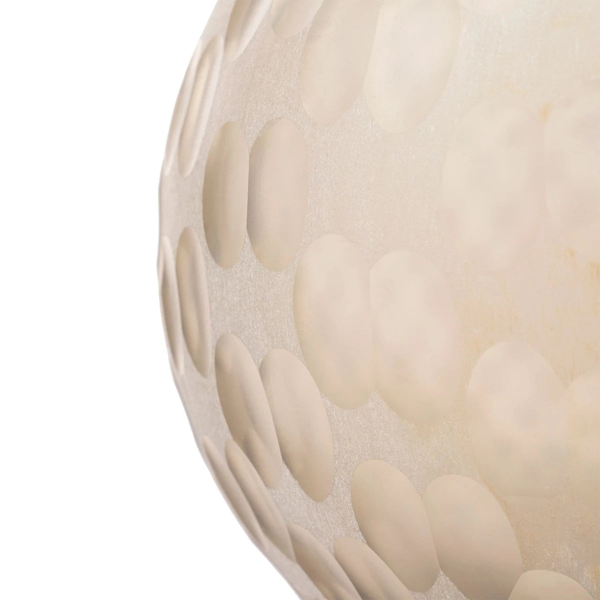 Close-up of a textured spherical object with a dimpled, dimple-dimple pattern in a warm cream or off-white color, set against a plain white background.