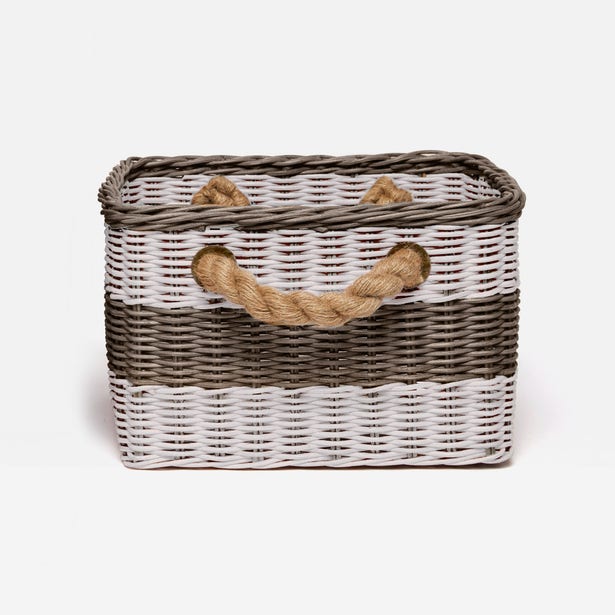Wicker basket with a rope handle on a white background