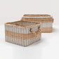Two woven baskets with natural and gray stripes on a white background