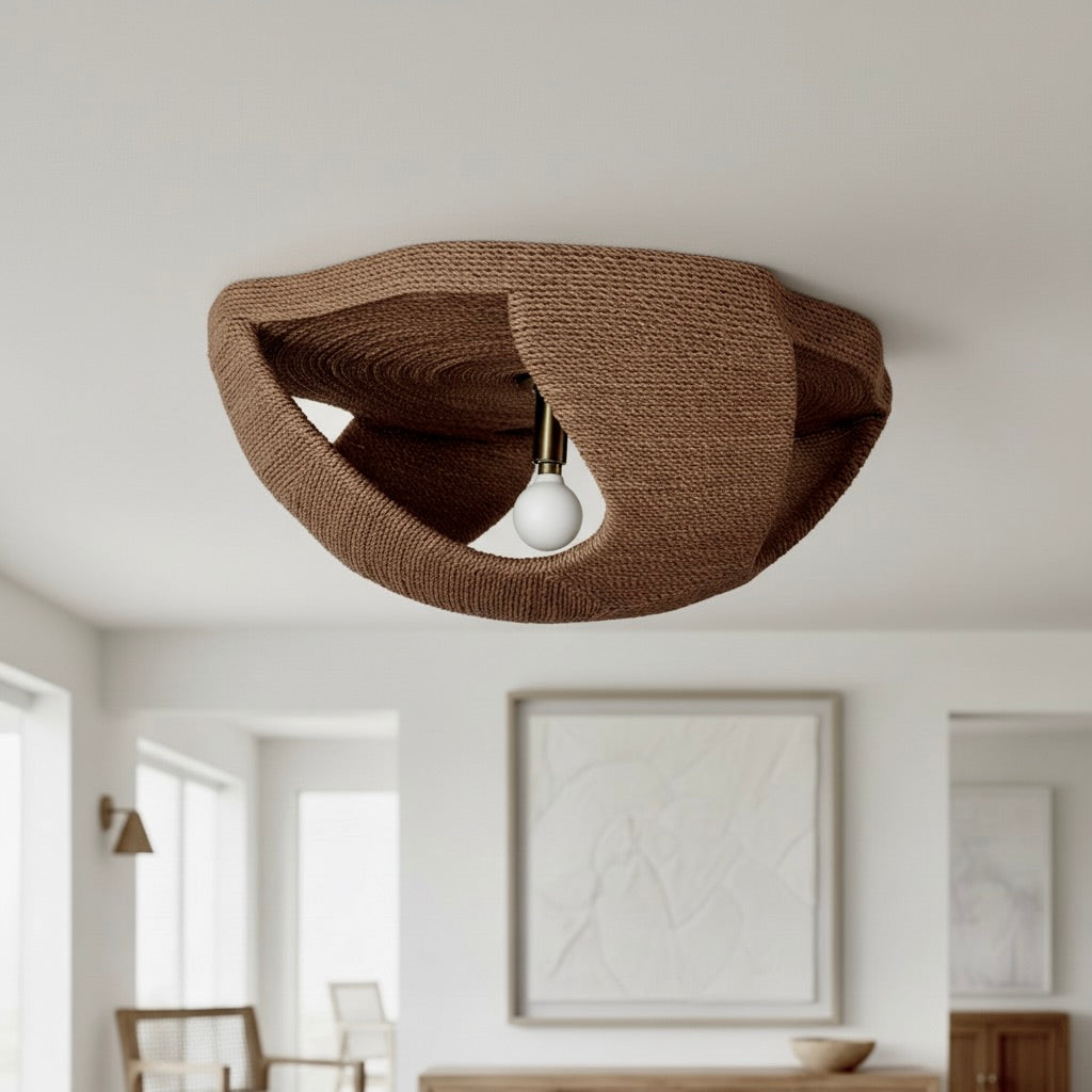 Brown ceiling light fixture in a room with white walls and furniture.