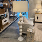 Living room with a white lamp, gray sofa, and decorative items.