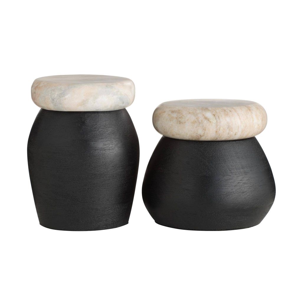 Two black cylindrical containers with beige marble lids on a white background