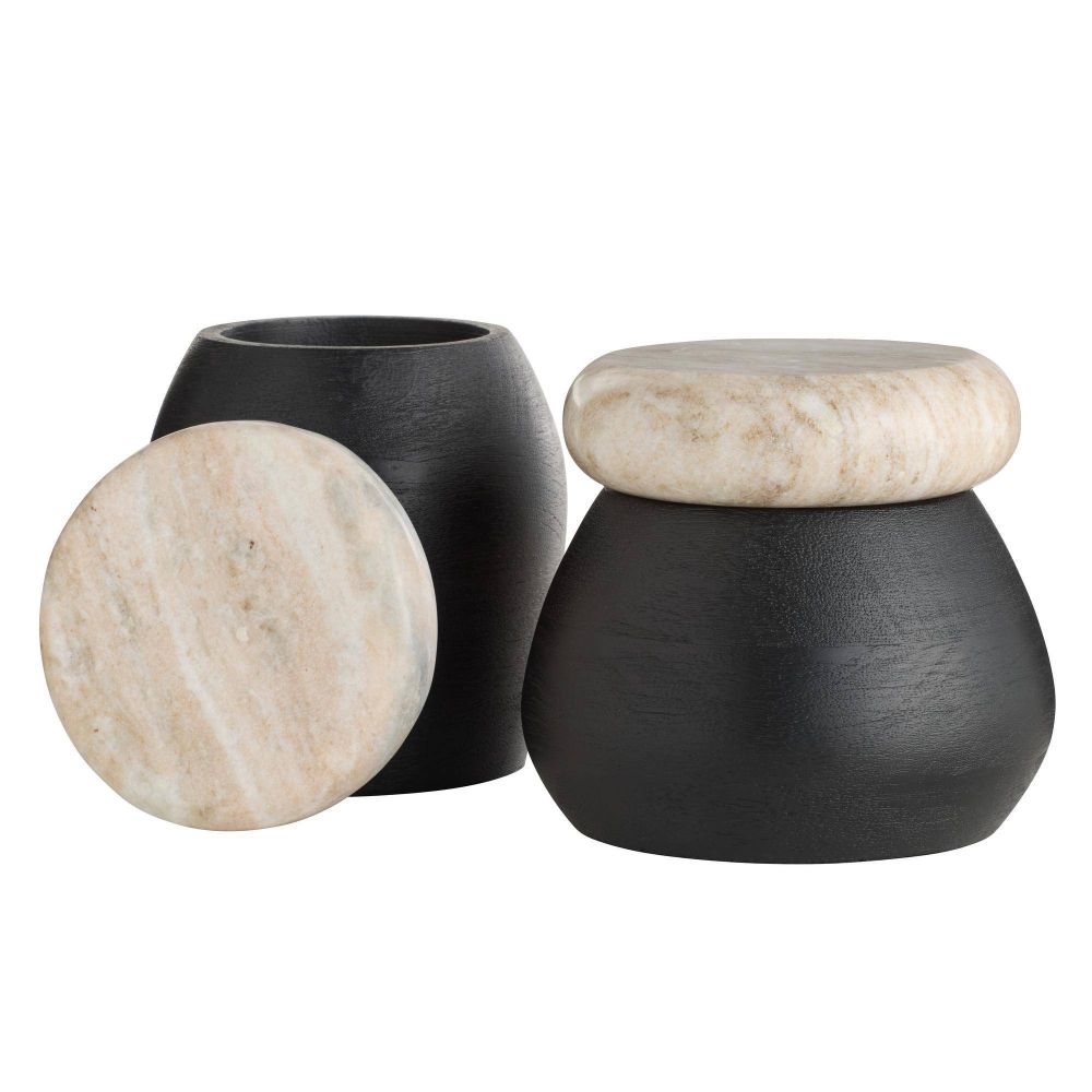 Two black containers with beige marble lids on a white background