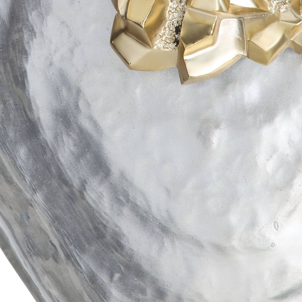 Gold decorative item on a marble surface