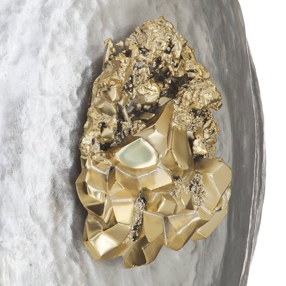 Gold crystal formation on a marble background