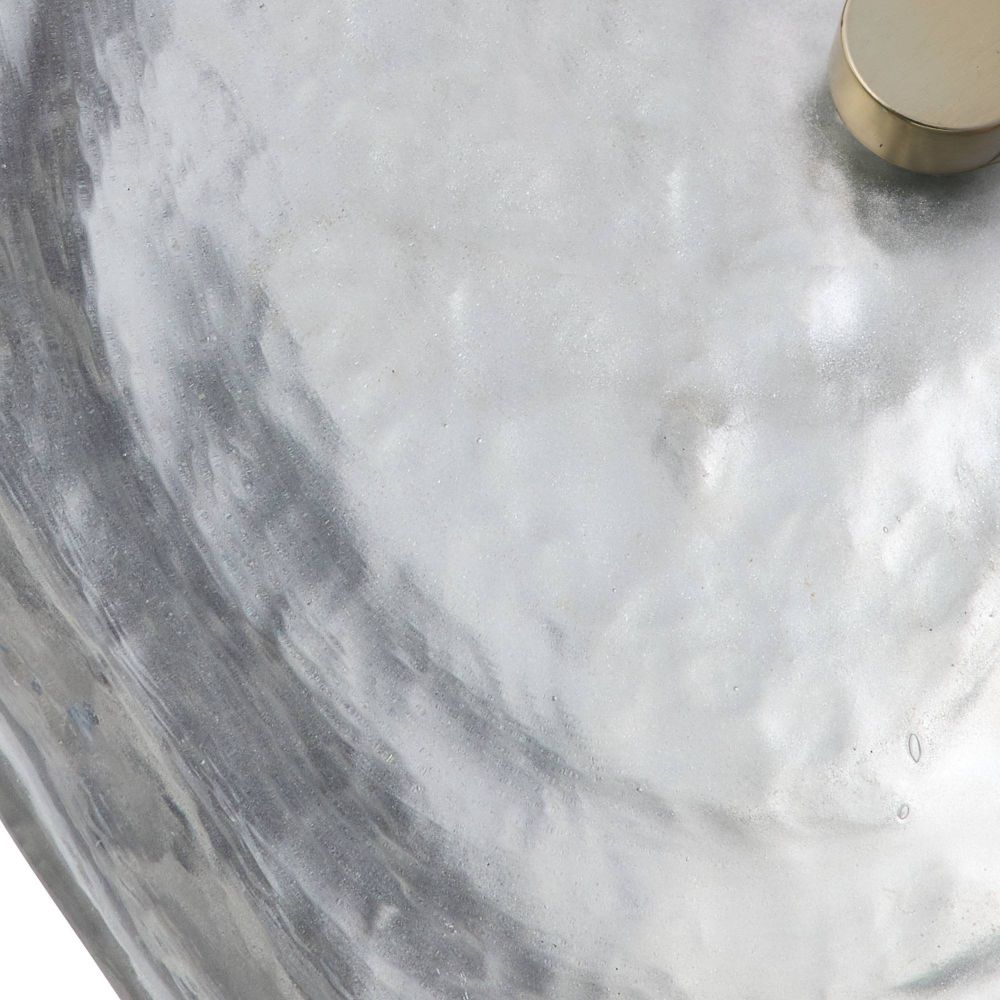 Marble-patterned surface with a gold circular object