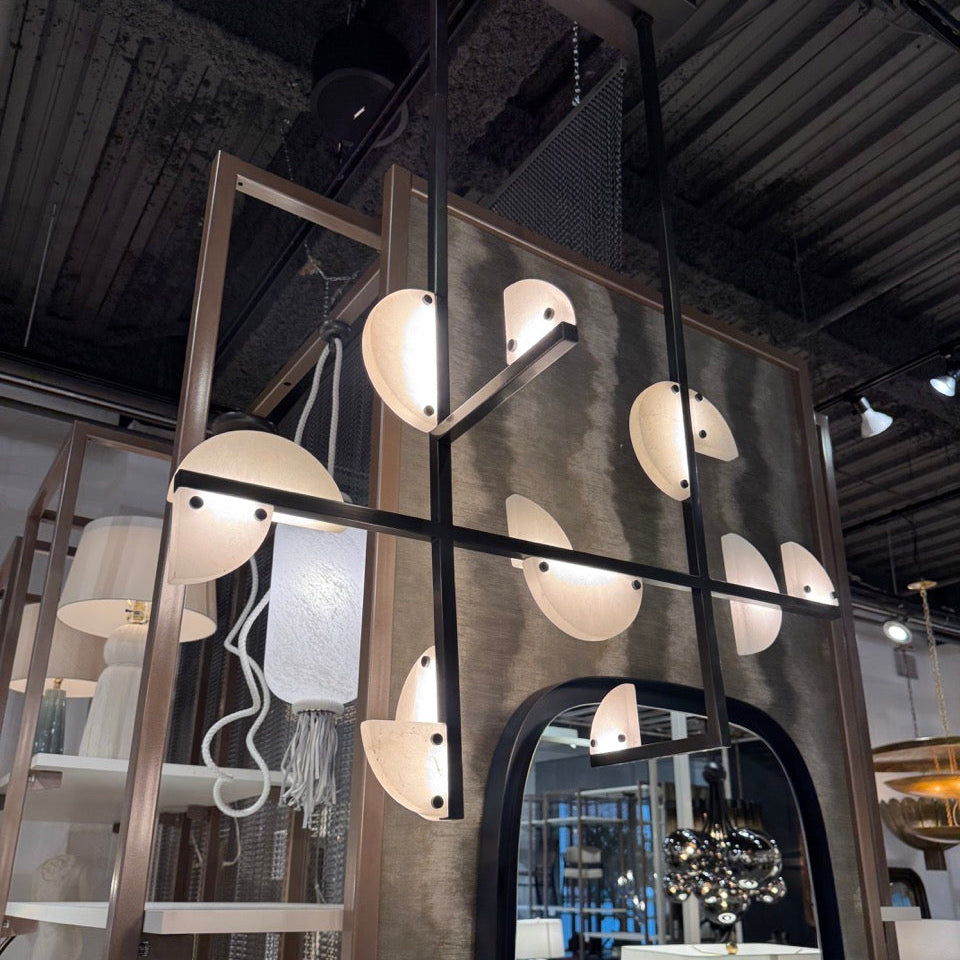 Modern interior design with hanging lights and a mirror.