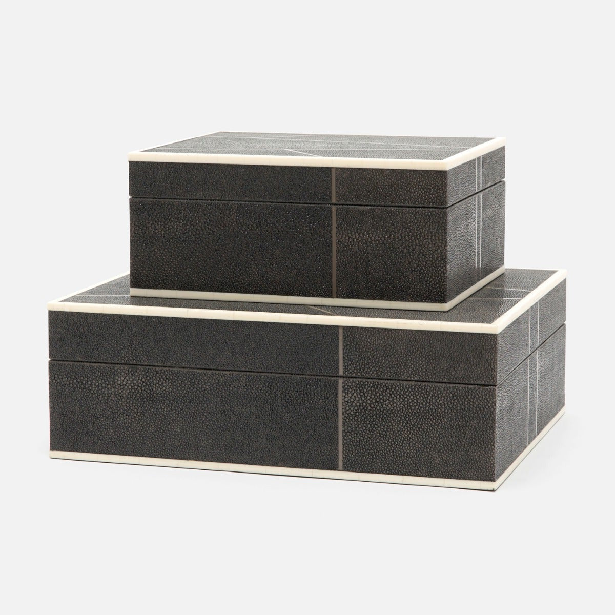 Two dark mushroom textured boxes stacked on a white background