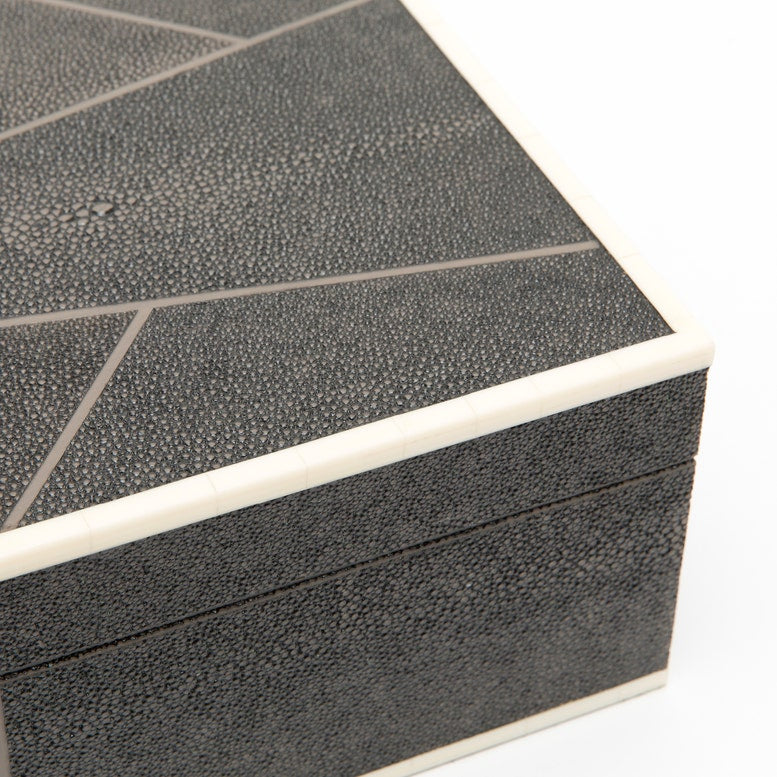 Close-up of a textured black box with a white interior