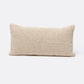 Beige woven pillow on a white background