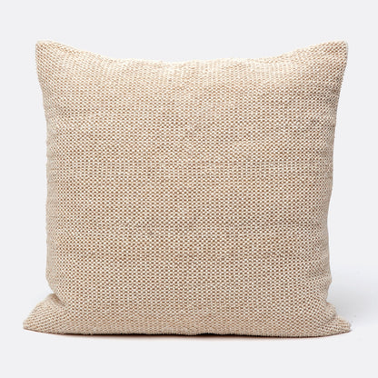 Beige textured pillow on a white background