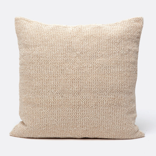 Beige textured pillow on a white background