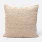 Beige textured pillow on a white background