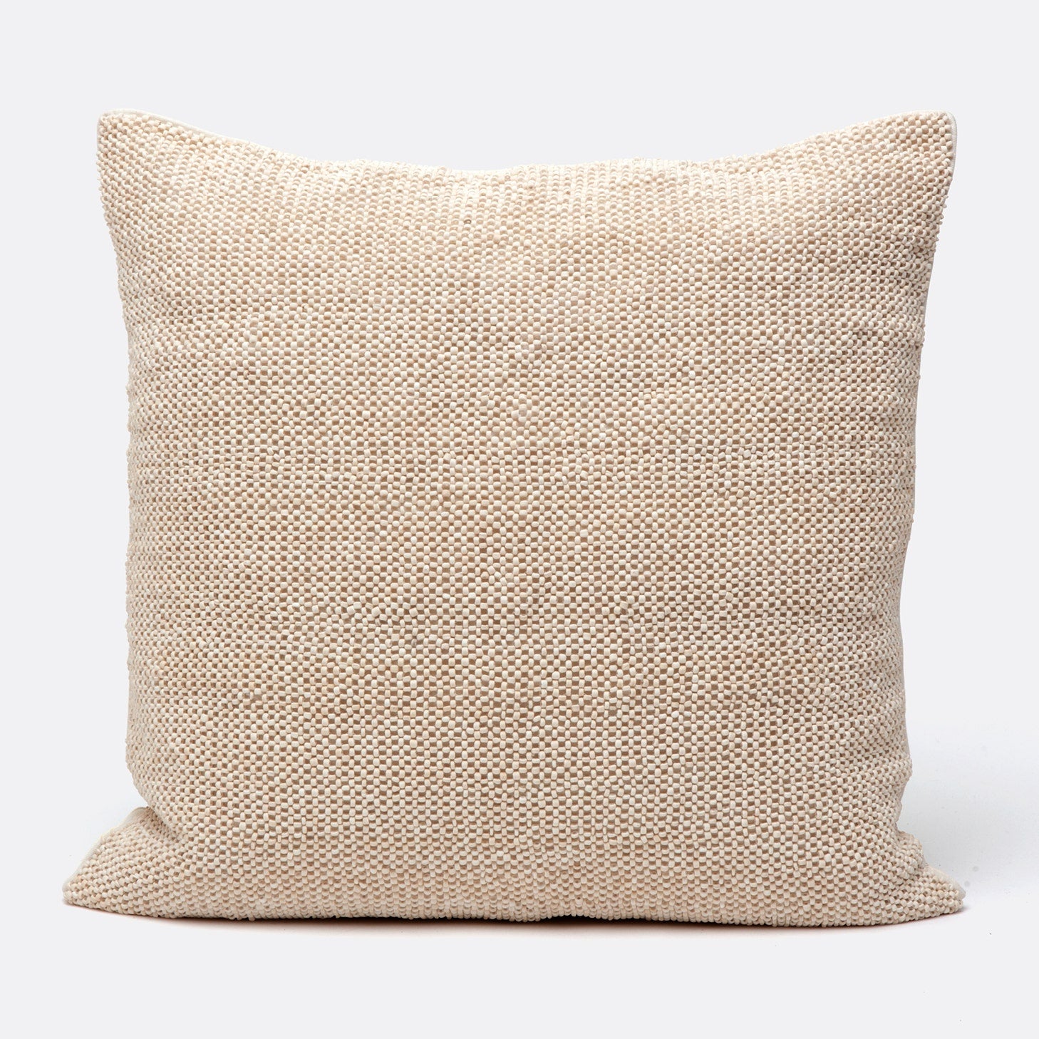 Beige textured pillow on a white background