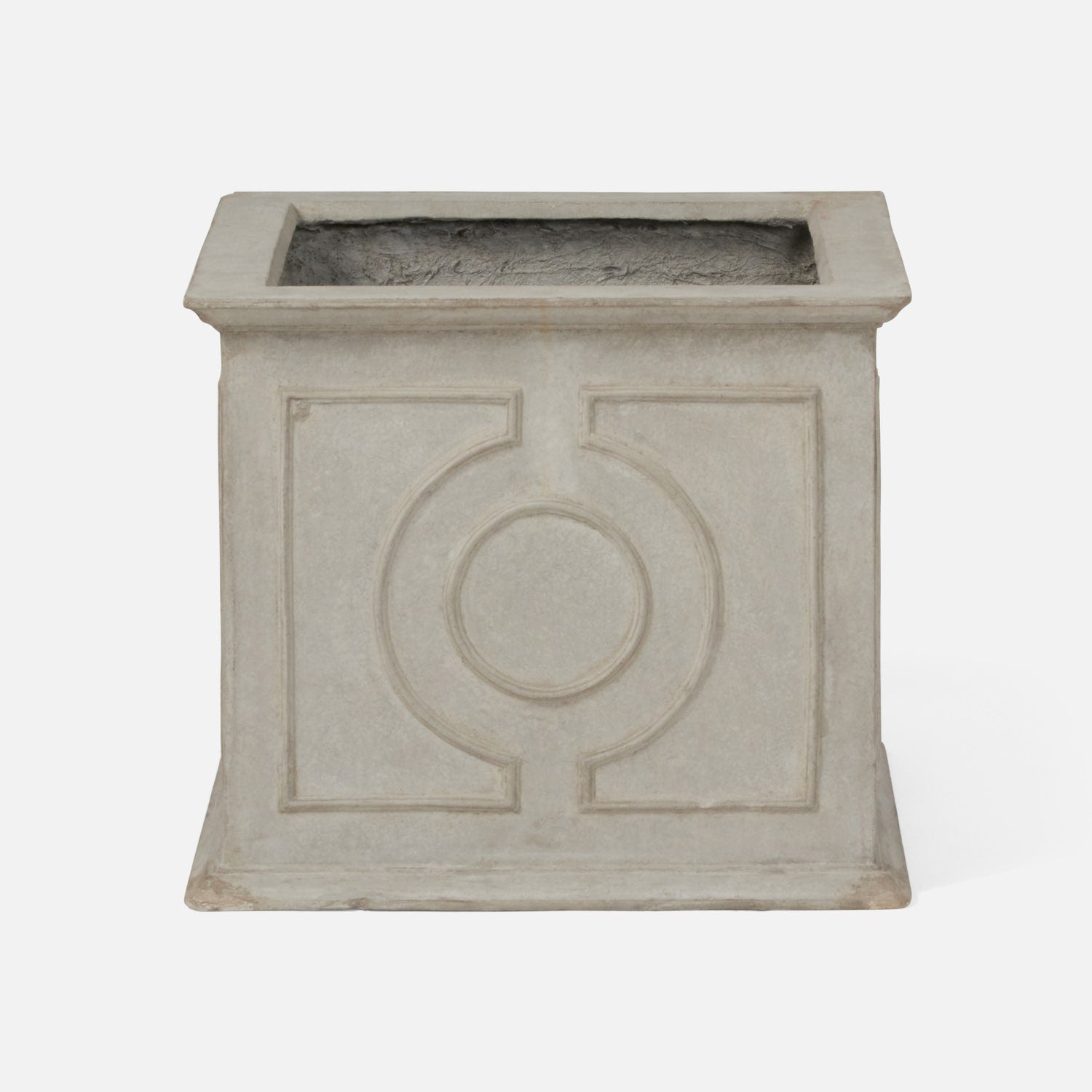 A square concrete planter with a textured light gray finish and a raised circular geometric design on the front, set against a plain white background.