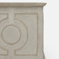 Close-up of a light gray stone or concrete decorative wall panel with embossed geometric and circular patterns, shown against a plain white background.