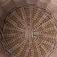 Close-up of a woven basket with a circular pattern
