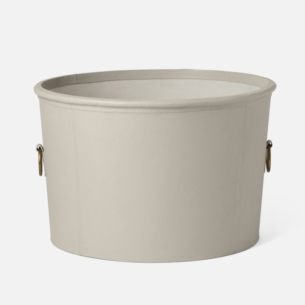 Beige fabric storage basket with handles on a white background