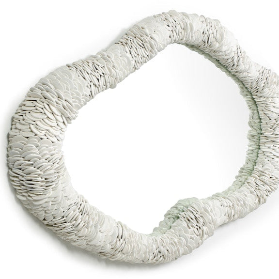 Round woven object on a white background