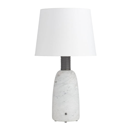 Table lamp with a white shade and textured white base on a white background