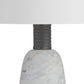 Close-up of a lamp with a marble base and gray ribbed design on a white background
