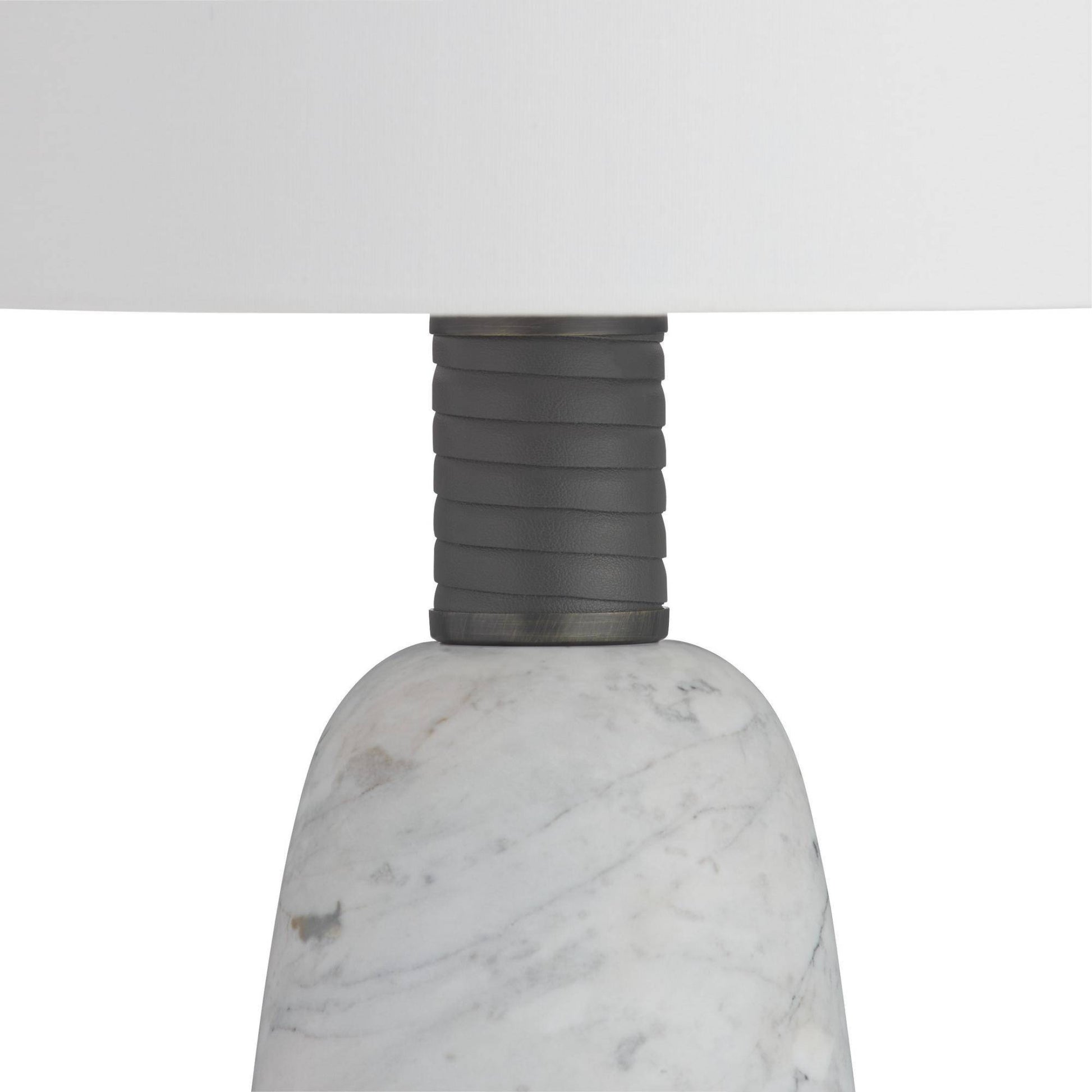 Close-up of a lamp with a marble base and gray ribbed design on a white background