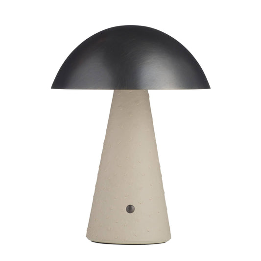 Table lamp with black dome shade and beige base on a white background